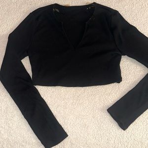 Woman’s black long sleeved cropped shirt size small